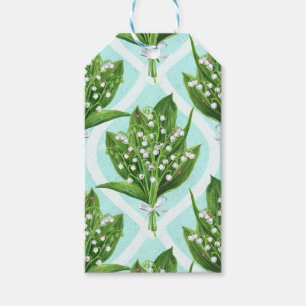 Bouquet of lily of the valley flowers on blue gift tags