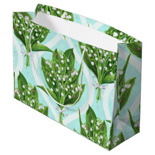 Bouquet of lily of the valley flowers on blue large gift bag