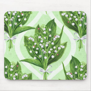 Bouquet of lily of the valley flowers on blue mouse mat