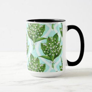 Bouquet of lily of the valley flowers on blue mug
