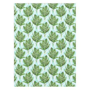 Bouquet of lily of the valley flowers on blue tablecloth