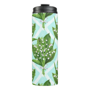 Bouquet of lily of the valley flowers on blue thermal tumbler