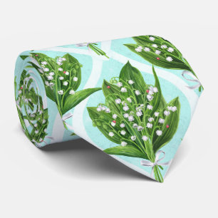 Bouquet of lily of the valley flowers on blue tie