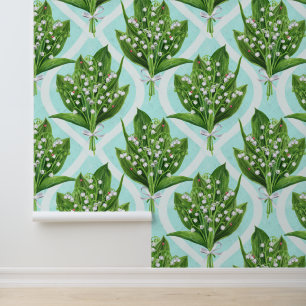 Bouquet of lily of the valley flowers on blue wallpaper