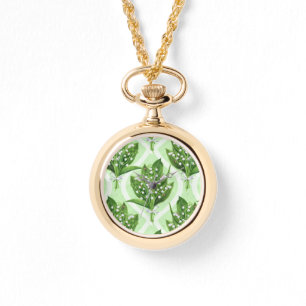 Bouquet of lily of the valley flowers on blue watch