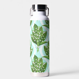 Bouquet of lily of the valley flowers on blue water bottle