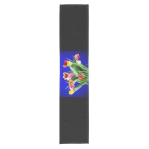 Bouquet of tulips on blue short table runner