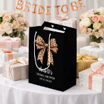Bow leopard print black Bridal Shower Medium Gift Bag<br><div class="desc">A black background. Decorated with a large bow with leopard print.  Personalise and add the bride's name and a date. Black handwritten style script.</div>
