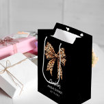 Bow leopard print black Bridal Shower Medium Gift Bag<br><div class="desc">A black background. Decorated with a large bow with leopard print.  Personalise and add the bride's name and a date. Black handwritten style script.</div>