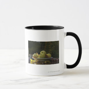 Bowl of apples and leaves mug