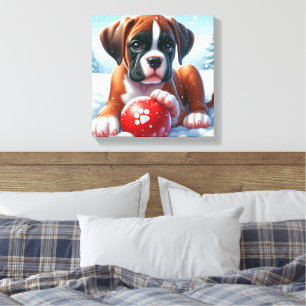 Boxer Puppy Playing in Snow with a Red Toy Ball Canvas Print