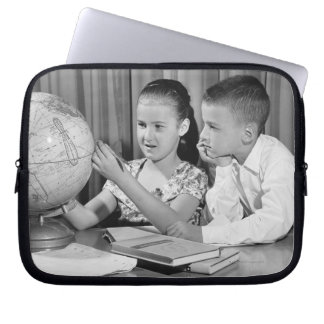 Boy and Girl Viewing Globe Laptop Sleeve
