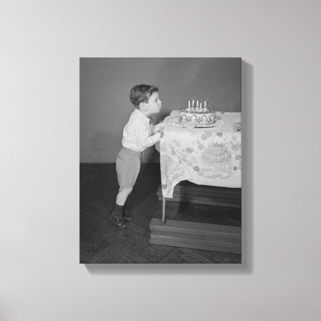 Boy Blowing Out Candles Canvas Print (Front)