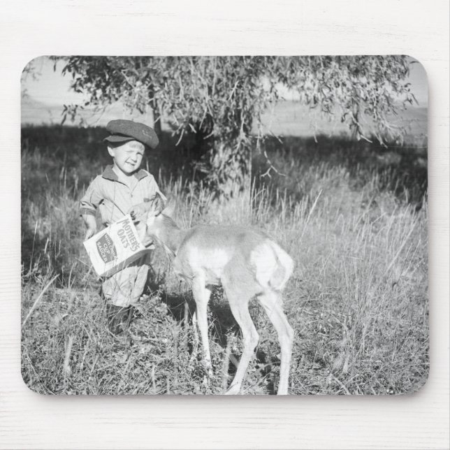 Boy feeding antelope by hand mouse mat (Front)