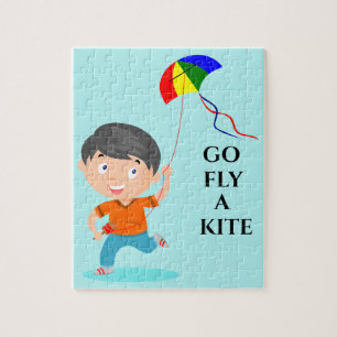 Boy flying kite puzzle. jigsaw puzzle