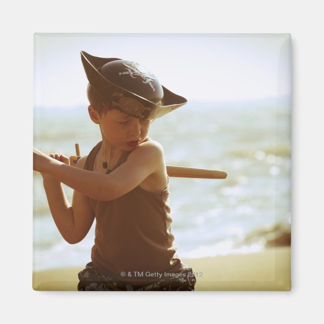 Boy playing pirate, wooden sword magnet (Front)