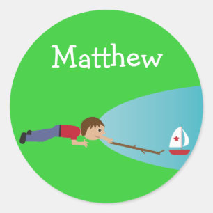 Boy playing with boat on pond stickers