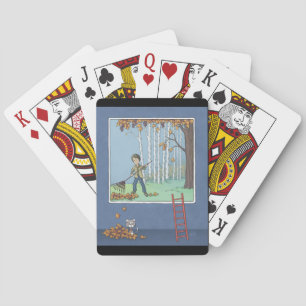 Boy raking leaves playing cards