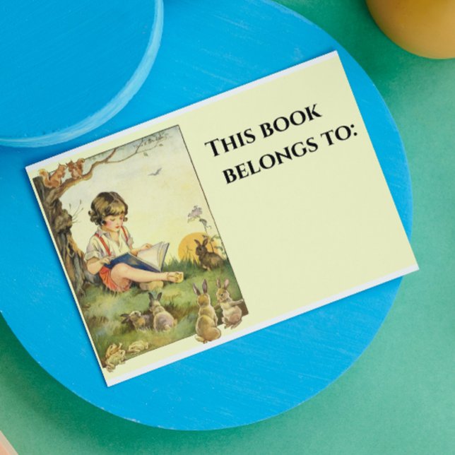 Boy reading under tree with rabbits rectangular sticker (Creator Uploaded)