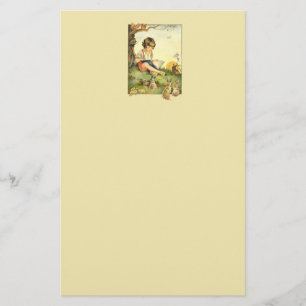 Boy reading under tree with rabbits stationery