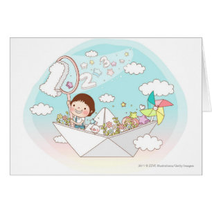 Boy sitting in paper boat