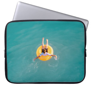 Boy sitting on buoy laptop sleeve