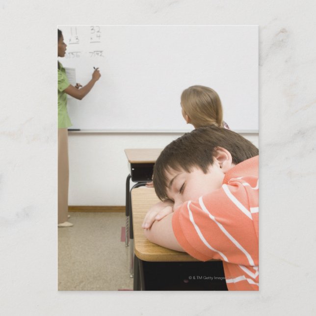 Boy sleeping on desk in classroom postcard (Front)