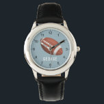 Boys Cute Sporty Football Kids Watch<br><div class="desc">This cute and modern kids watch features an American football,  with a blue background. The sporty watch can be personalised with your boys name,  and clear numbers,  the perfect gift for any sports or rugby lover.</div>