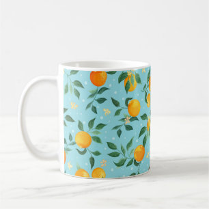 Branches of oranges with flowers on a blue backgro coffee mug