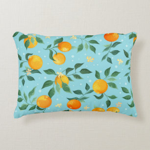 Branches of oranges with flowers on a blue backgro decorative cushion