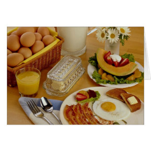 Breakfast of bacon, eggs and pitcher of milk