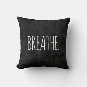 BREATHE Text on Black Leather Cushion