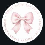 Bridal Shower Pink Bow She's Tying the Knot  Classic Round Sticker<br><div class="desc">A simple design for a bridal shower with pink bow theme. It has a pink bow, painted ion watercolor, and circular text around it. The text "she's tying the knot" is written in pink arched caps above the bow. Under the bow there is the name, occasion and date, also in...</div>