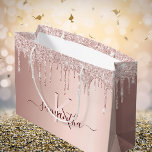 Bridal Shower rose gold glitter pink monogram Large Gift Bag<br><div class="desc">A gift bag for a girly and glamourous Bridal Shower, bachelorette party. A faux rose gold background with elegant pink and rose gold glitter drips, paint dripping look. Personalise and add a name and monogram letter. The name is written in burgundy with a modern hand lettered style script with swashes....</div>