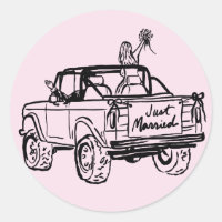 bride and groom in a just married SUV 