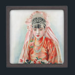 Bride in Red at Chinese Wedding in Shanghai Gift Box<br><div class="desc">The air crackled with the joyous anticipation of a wedding day. The young woman, Xiaohua, stood bathed in the warm glow of the room, a vision of youthful elegance. Her face, flawless with a touch of light makeup that emphasised her youthful features, was framed by a cascade of black hair...</div>