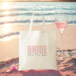 Bride Tote Bag | Personalised Future Mrs. Name<br><div class="desc">This elegant personalised “Bride” tote bag is the perfect accessory for any bride-to-be! Featuring bold blush pink “BRIDE” lettering and customisable “future Mrs. [Name]” script underneath, it's a chic and practical gift for bridal showers, bachelorette weekends, or wedding day essentials. Lightweight and reusable, this bridal tote fits everything from makeup...</div>