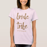 Bride Tribe Gold Glitter Bachelorette Party T-Shirt<br><div class="desc">This bride tribe t-shirt is perfect for celebrating bachelorette parties. This blush pink shirt features faux gold glitter style lettering on the front. Personalise these tees with your recipient's name on the front and the bride and groom's names and wedding date on the back.</div>