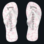 Bridesmaid Beach Wedding | Floral White Lace Pink Flip Flops<br><div class="desc">Personalised, romantic floral lace beach wedding flip flop sandals- Faux vintage style, floral white lace on feminine pink background. Name of bridesmaid at top in curved, elegant style, script letters. Bridesmaid is printed down the middle in modern lettering. Change to fit bridal party members, such as bride, flower girl or...</div>
