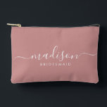 Bridesmaid Modern Minimal Script Dusty Pink Accessory Pouch<br><div class="desc">This Bridesmaid accessory bag features a handwritten white script typography with swashes on a dusty pink background. Present your bridesmaids with a toiletry bag for their makeup and small items traditionally presented at the rehearsal dinner,  for use in the early morning before the wedding.</div>