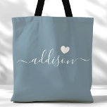 Bridesmaid Modern Script Heart Dusty Blue Tote Bag<br><div class="desc">This chic tote bag features a beautiful Dusty Blue background adorned with a modern script font and a delicate heart design. The soft, elegant colour and sophisticated typography make it an ideal accessory for bridesmaids or anyone who loves stylish and trendy designs. Perfect for carrying essentials, this tote bag adds...</div>