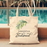 Bridesmaid Palm Leaf Personalised Bridal Party Tote Bag<br><div class="desc">Bridal party gift to personalise for your bridesmaid - or anyone in your wedding party. Bridesmaid is lettered in swirly handwritten calligraphy and, you can easily switch this to a different role, by entering the design tool. The design features a watercolor tropical palm leaf which is also used in the...</div>