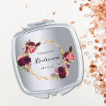 Bridesmaid watercolored florals burgundy silver compact mirror<br><div class="desc">A trendy bohemian boho style gift for the Bridesmaid. Decorated with watercolored roses in burgundy and pink. Elegant faux silver metallic looking background. A faux gold geometric frame. With the text: Bridesmaid written with a hand lettered style script. Template for the Bridesmaid name and a date. Black coloured letters. Perfect...</div>