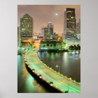 Bridge leads across waterway to downtown Miami Poster