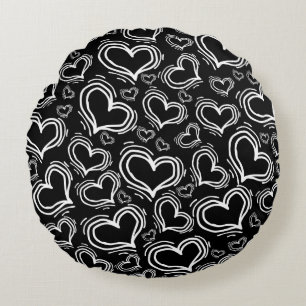 BRIGHT BLACK WITH WHITE HEARTS AND FLOWERS ROUND CUSHION