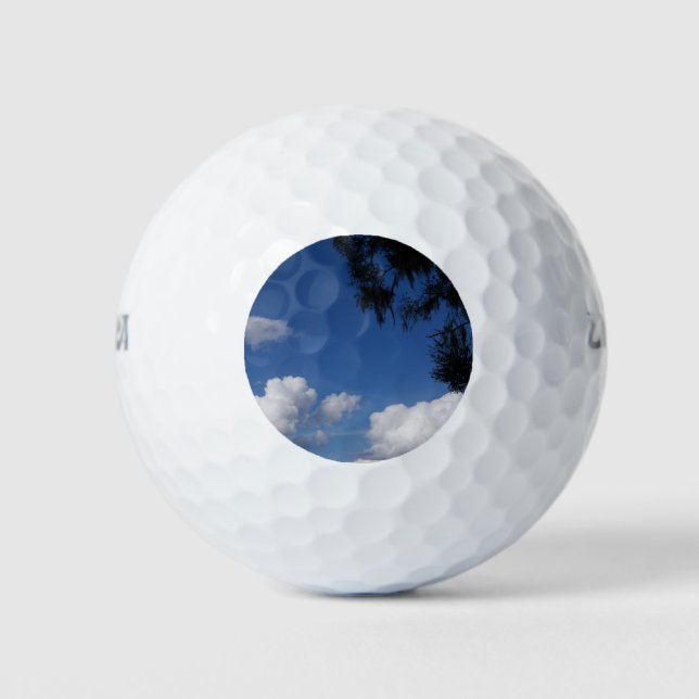 Bright blue sky and a few white clouds golf balls (Front)