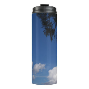 Bright blue sky and a few white clouds thermal tumbler