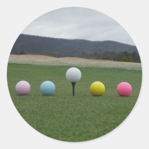 bright coloured Golf Balls on a mountain Classic Round Sticker