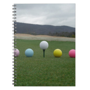 bright coloured Golf Balls on a mountain Notebook