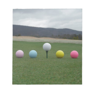 bright coloured Golf Balls on a mountain Notepad